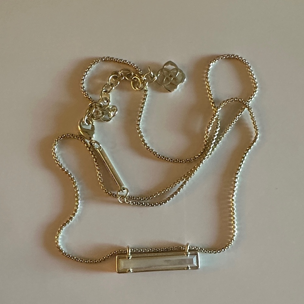 Kendra Scott light gold necklace with pearl-tone bar pendant